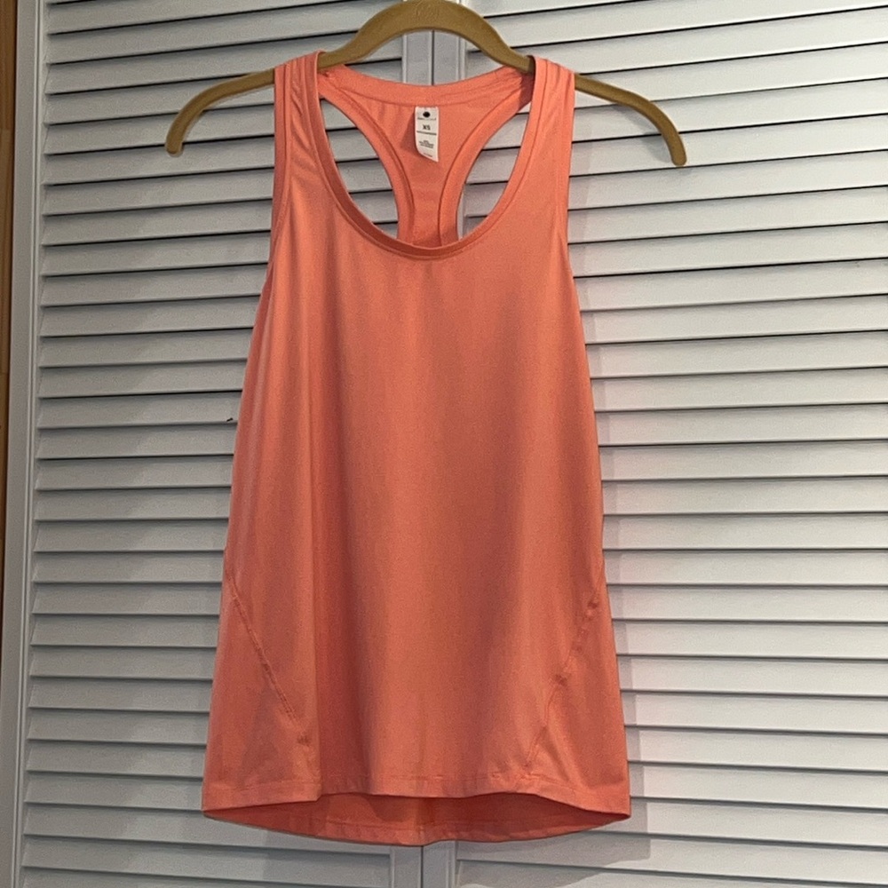 YOGAlicious Racer-Back Tank Top. Size XS. Color is a pretty Coral/Salmon.